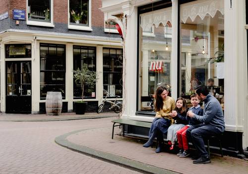 Vacation Photography of Family photo session in Amsterdam streets with hot chocolate
