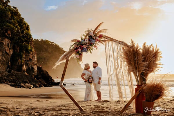 Brava Casa, Buzios, Rio de Janeiro, Brasil elopement ceremony image -  celebrating the wedding in front of the sea