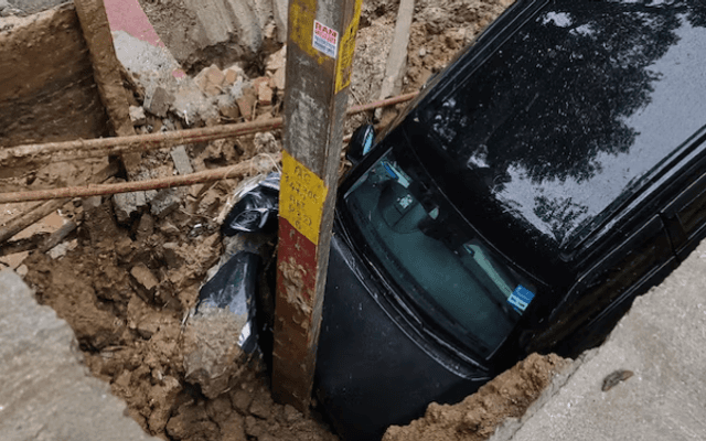 Heavy Rain Triggers Road Cave-In in Ghaziabad, Vehicles Slip into Construction Pit