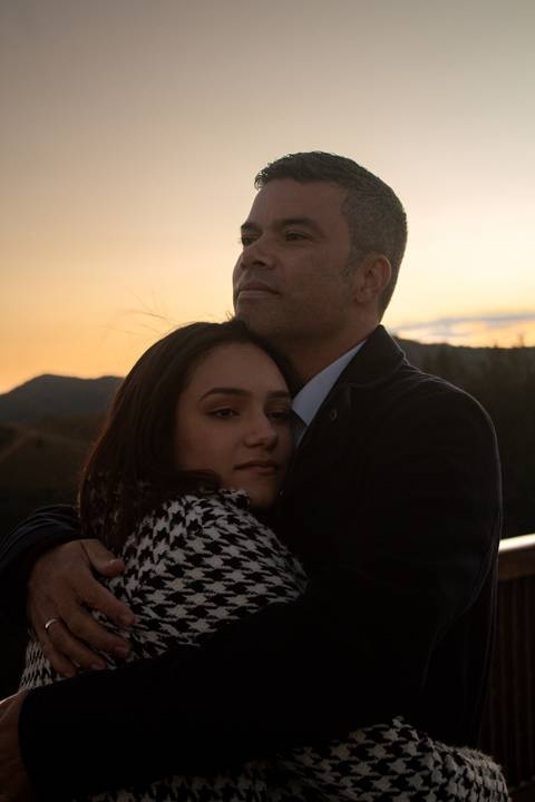 Fotografia de casal ao pôr do sol'