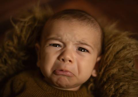 Bebê fazendo beicinho'