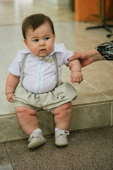 Fotografia de bebê em batizado'
