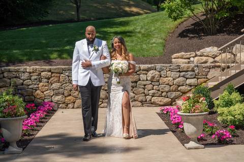 Photo by Vanessa Trettel,
Wedding photographer at Venue The Water View, Monroe, CT in July 2022.
It is an image of the bride and her son standing with the bouquet'