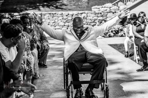 Photo by Vanessa Trettel,
Onsite wedding photographer at The Water View, Monroe, CT in July 2022.
It is an image of the groom in his wheelchair at The Water View Venue in Monroe, CT'