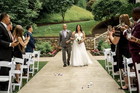 Captured in golden light, Briana & Nicholas steal a quiet moment together at The Waterview in Monroe, CT. The serene lake in the background enhances the romantic atmosphere as they embrace, lost in the love and joy of their special day.'