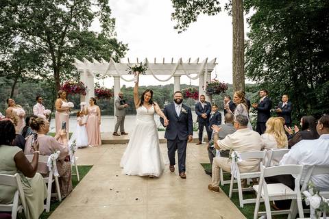 Briana shares a heartfelt First Look with her father at The Waterview in Monroe, CT. Her father’s eyes light up as he sees her in her wedding dress for the first time, capturing an unforgettable, emotional moment filled with love and pride.'