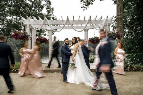 A jubilant wedding reception at The Waterview in Monroe, CT. The bride and groom dance the night away, surrounded by cheering guests. The energy is electric as the celebration continues, perfectly capturing the spirit of Briana & Nicholas’s love story.'