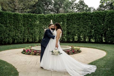 A jubilant wedding reception at The Waterview in Monroe, CT. The bride and groom dance the night away, surrounded by cheering guests. The energy is electric as the celebration continues, perfectly capturing the spirit of Briana & Nicholas’s love story.'