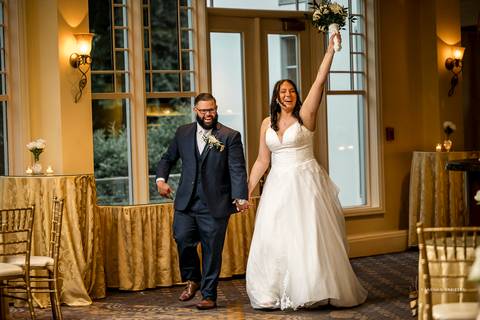A jubilant wedding reception at The Waterview in Monroe, CT. The bride and groom dance the night away, surrounded by cheering guests. The energy is electric as the celebration continues, perfectly capturing the spirit of Briana & Nicholas’s love story.'