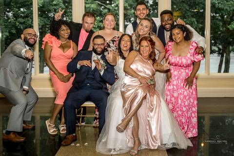 A jubilant wedding reception at The Waterview in Monroe, CT. The bride and groom dance the night away, surrounded by cheering guests. The energy is electric as the celebration continues, perfectly capturing the spirit of Briana & Nicholas’s love story.'