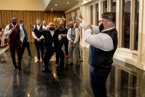 Captured in golden light, Briana & Nicholas steal a quiet moment together at The Waterview in Monroe, CT. The serene lake in the background enhances the romantic atmosphere as they embrace, lost in the love and joy of their special day.'