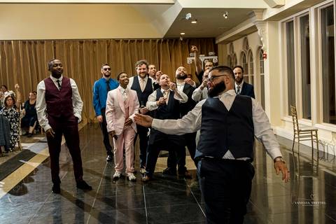 A jubilant wedding reception at The Waterview in Monroe, CT. The bride and groom dance the night away, surrounded by cheering guests. The energy is electric as the celebration continues, perfectly capturing the spirit of Briana & Nicholas’s love story.'