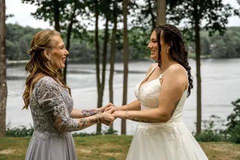 Briana shares a heartfelt First Look with her father at The Waterview in Monroe, CT. Her father’s eyes light up as he sees her in her wedding dress for the first time, capturing an unforgettable, emotional moment filled with love and pride.'