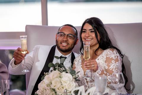 Jessica & Ben share a tender moment during their sunset ceremony at Anthony's Ocean View in New Haven, CT. The golden light reflects off the ocean, creating a stunning backdrop as they exchange vows surrounded by family and friends.'