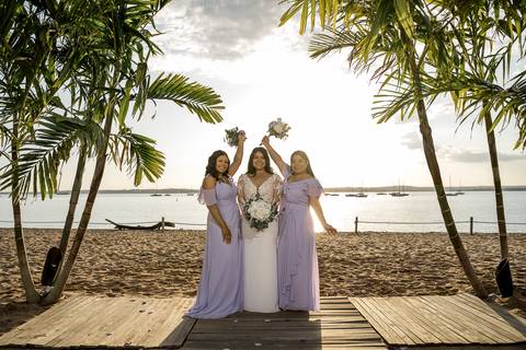 Ben, originally from Connecticut, and his bride Jessica, enjoy a joyful walk down the aisle at Anthony's Ocean View. Their smiles radiate pure happiness as they celebrate their love in front of family and friends.'