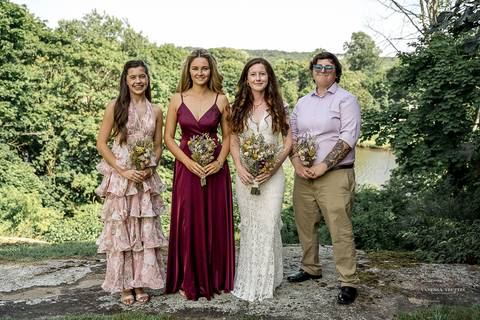 Bridesmaids in soft pastel dresses cheer as they see the bride for the first time. Light, joyful wedding moment in Connecticut summer sun.
Vanessa Trettel best wedding photographer in CT
wedding photos Mystic '