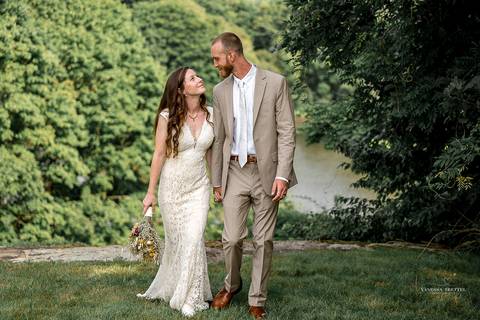 Macie and Joshua walk hand-in-hand along the waterfront, with sunlit skies and sailboats in the background. A perfect summer wedding in Mystic, CT.
Vanessa Trettel best wedding photographer in CT'