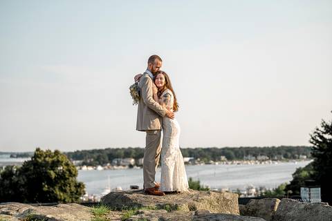 Macie and Joshua walk hand-in-hand along the waterfront, with sunlit skies and sailboats in the background. A perfect summer wedding in Mystic, CT.
Vanessa Trettel best wedding photographer in CT'