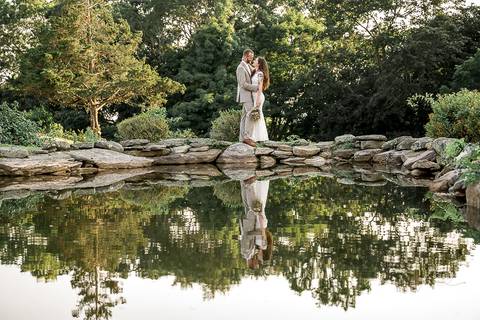 Macie and Joshua walk hand-in-hand along the waterfront, with sunlit skies and sailboats in the background. A perfect summer wedding in Mystic, CT.
Vanessa Trettel best wedding photographer in CT'
