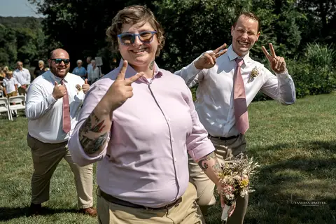 Bridesmaids in soft pastel dresses cheer as they see the bride for the first time. Light, joyful wedding moment in Connecticut summer sun.
Vanessa Trettel best wedding photographer in CT
wedding photos Mystic '