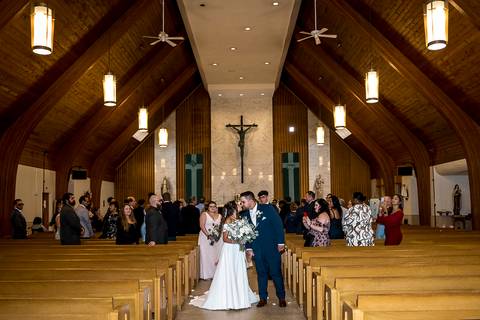 The couple shares their first kiss as newlyweds inside the church, surrounded by joyful guests.
Saint Therese Church at North Haven, CT
Vanessa Trettel Photography'