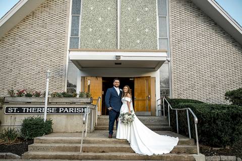 The bride and groom pose in front of the church, smiling as the sun highlights the beauty of their wedding day.
Saint Therese Church at North Haven, CT
Vanessa Trettel Photography'