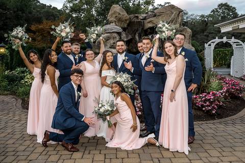 Groomsmen and bridesmaids celebrate during cocktail hour, sharing laughs and posing together.
Cascade Fine Catering in Hamden, CT
Vanessa Trettel Photography'