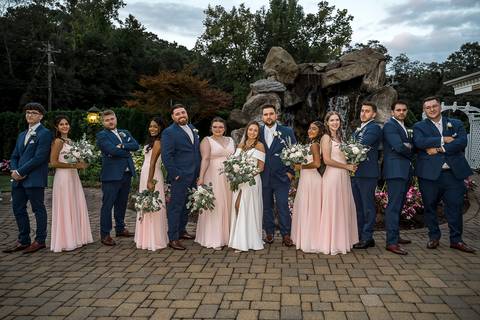 The wedding party enjoys the cocktail hour, capturing a fun and lively moment as guests mingle.
Cascade Fine Catering in Hamden, CT
Vanessa Trettel Photography'