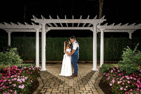 The couple shares a romantic night portrait at the venue, illuminated by soft outdoor lighting.
Cascade Fine Catering in Hamden, CT
Vanessa Trettel Photography'