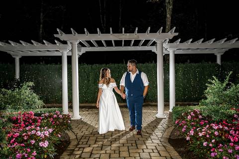A dreamy nighttime photo of the bride and groom, captured against the glowing backdrop of the venue.
Cascade Fine Catering in Hamden, CT
Vanessa Trettel Photography'