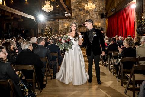 A heartfelt moment as Laura and Lee exchange vows under the soft glow of winter light, surrounded by rustic charm and the warmth of their loved ones in Branford, CT.'