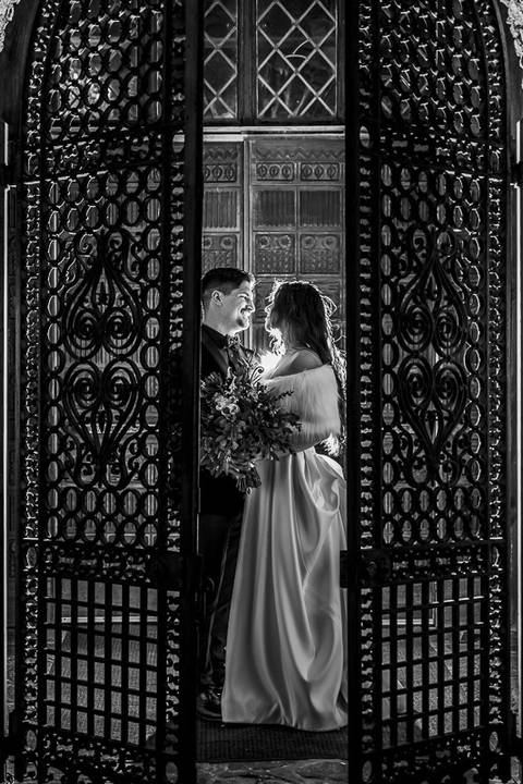 Under a starlit December sky, Laura and Lee stand embraced outside Bill Miller’s Castle, with its glowing windows and twinkling lights adding a romantic, magical ambiance.'