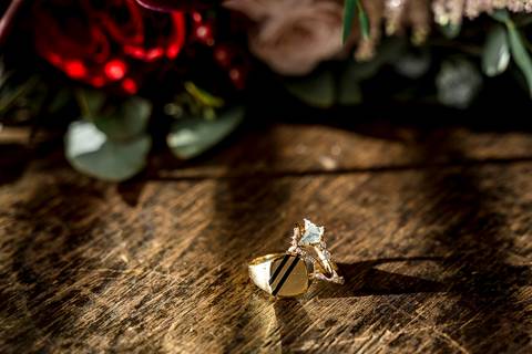 Laura, glowing with excitement, adjusts her veil by the castle’s ornate mirror, the soft natural light and vintage décor creating a picture-perfect start to her day.'