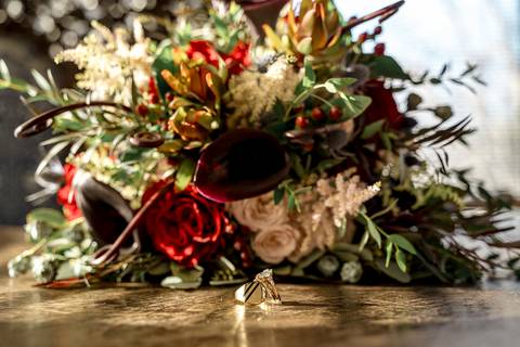 Laura, glowing with excitement, adjusts her veil by the castle’s ornate mirror, the soft natural light and vintage décor creating a picture-perfect start to her day.'