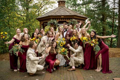 The full wedding party of bridesmaids and groomsmen cheering for the newlyweds at a CT wedding venue.
Vanessa Trettel Photography
Wedding photo at Pavillion on Crystal Lake | Middletown - CT'