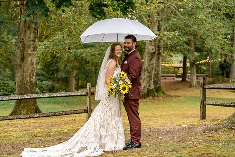 Romantic wedding portrait of Haily and Sean under a clear umbrella during a rainy afternoon at a CT lakeside venue.
Vanessa Trettel Photography
Wedding photo at Pavillion on Crystal Lake | Middletown - CT'