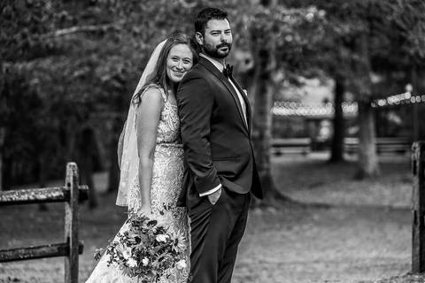 Dramatic black and white photo of a bride and groom embracing in the rain without an umbrella, capturing raw emotion.
Vanessa Trettel Photography
Wedding photo at Pavillion on Crystal Lake | Middletown - CT'