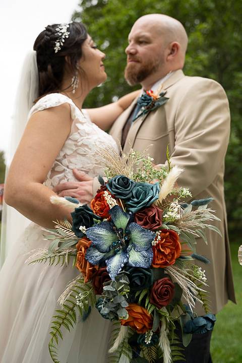 Golden hour photo of the newlyweds under the open sky, surrounded by fields and rustic charm — a dreamy farm wedding in Sterling, CT.'