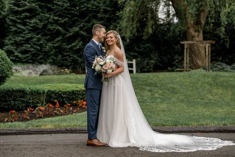 A black-and-white close-up capturing an intimate moment just after their “I do.”'
