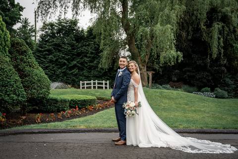 A gentle forehead kiss captured under soft golden light.'