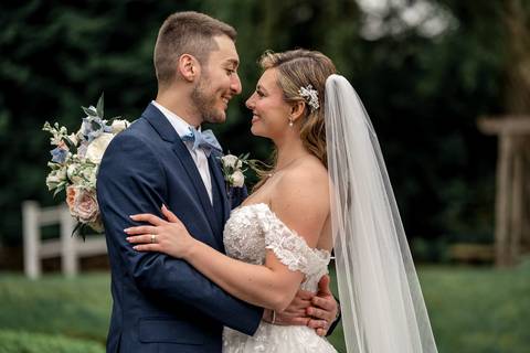 A dreamy sunset portrait of Katelyn and Casey walking hand-in-hand through the garden paths.'