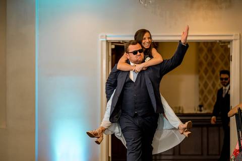 Katelyn and Casey make a grand entrance to cheers and applause, full of excitement and love.'