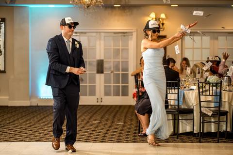 Katelyn and Casey make a grand entrance to cheers and applause, full of excitement and love.'