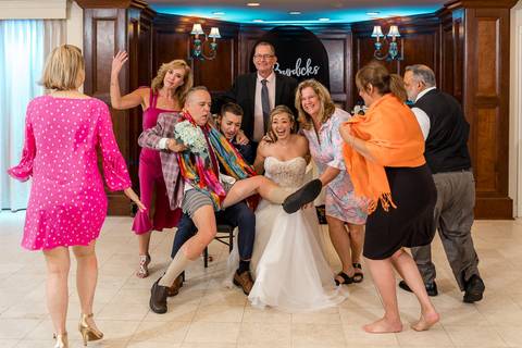 Guests laughing and striking poses in the PhotoDash booth — capturing the night’s fun energy.'