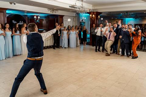 The dance floor packed with energy — guests celebrating with pure happiness.'