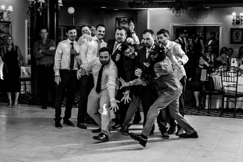 The dance floor packed with energy — guests celebrating with pure happiness.'