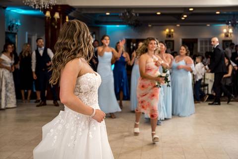 The dance floor packed with energy — guests celebrating with pure happiness.'