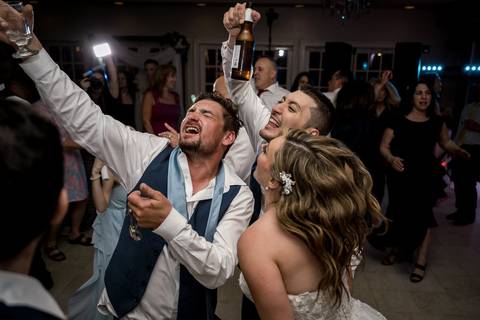 The couple laughing mid-spin — one of those unposed, magic moments every photographer loves to catch.'
