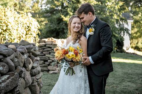 Moody artistic photo of the bride’s veil blowing in the wind, creating timeless romance at a Connecticut farm wedding venue.'