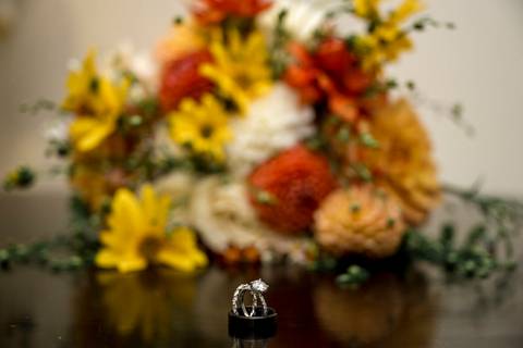 Creative detail shot of the bride’s bouquet resting on vintage wood, an artistic highlight of Gastler Farm’s rustic wedding vibe.'